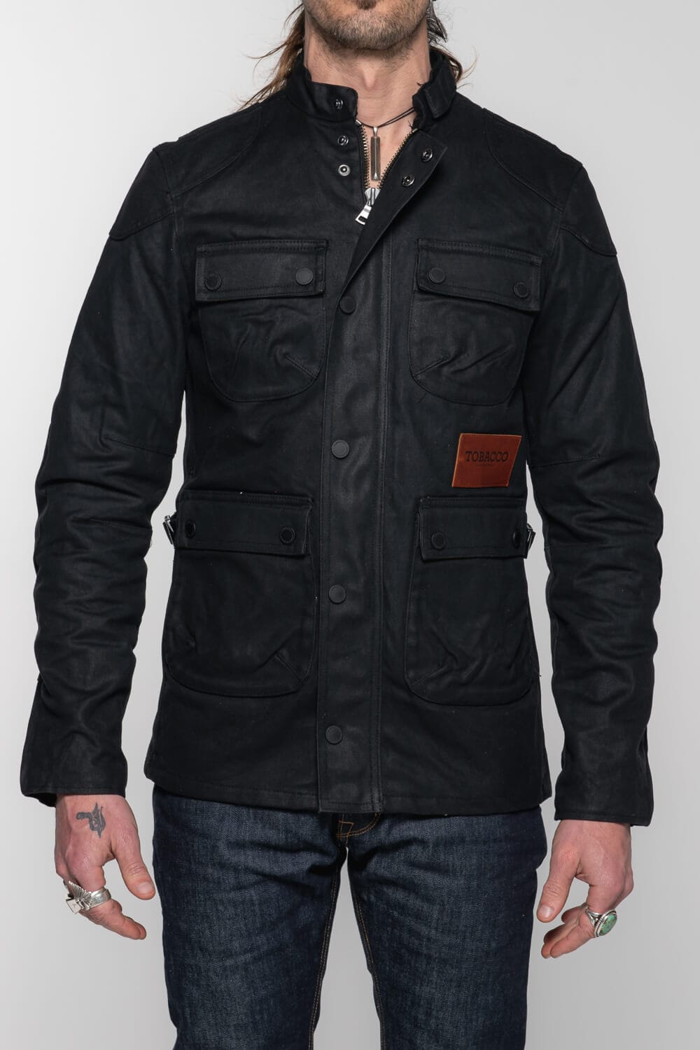 The McCoy Waxed Canvas Protective Jacket - Black. Pockets for D3O